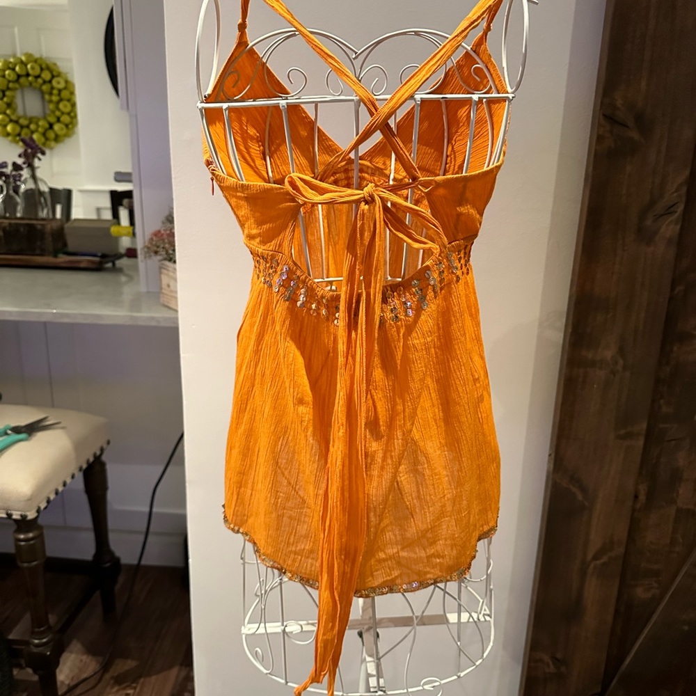 Woman’s orange backless, sequin shirt - Picture 2 of 3